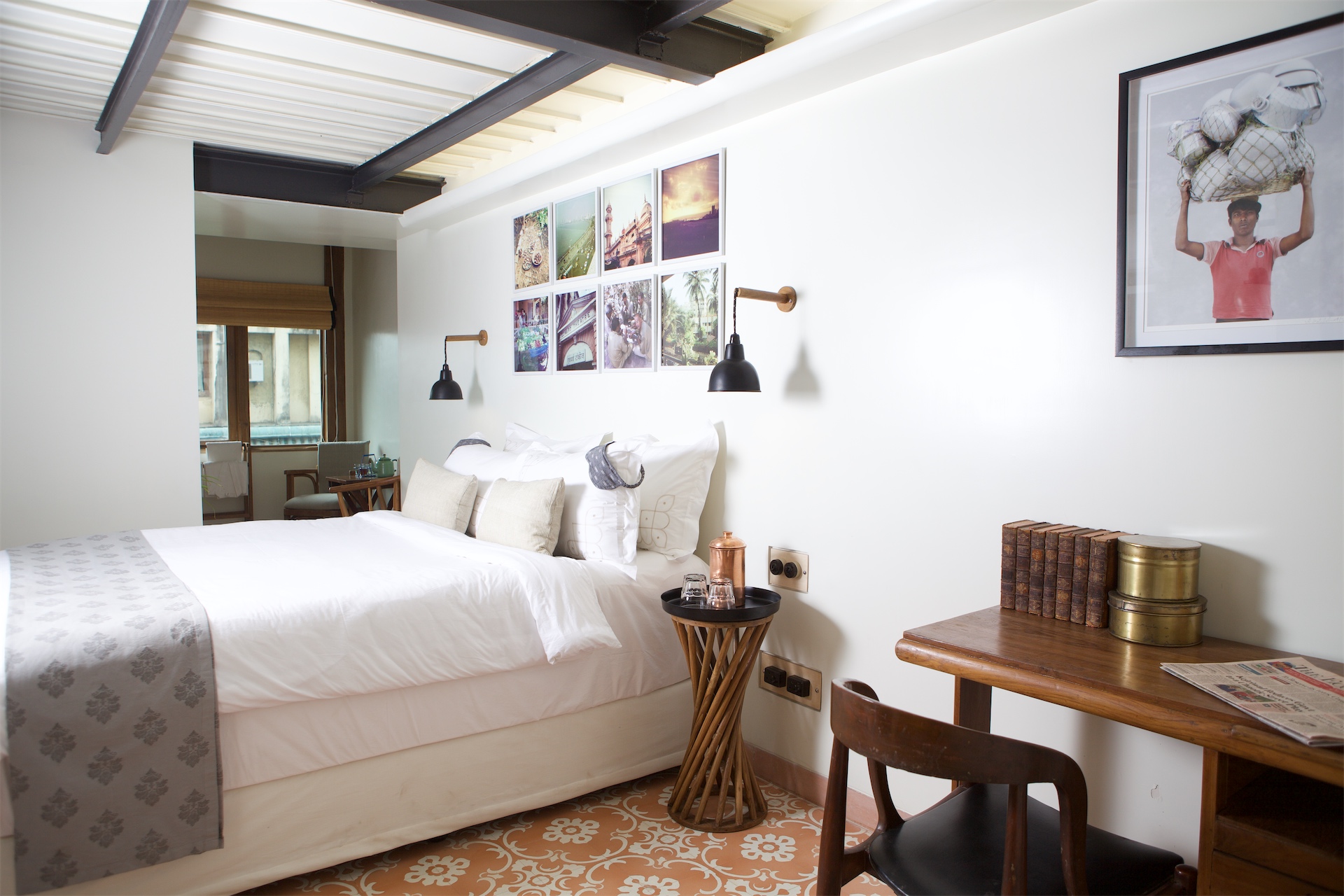 Guest bedroom with writing desk at Abode Bombay in Mumbai.