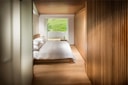 Minimalist bedroom in the Tadao Ando suite at 7132 House of Architects in Vals, Switzerland.