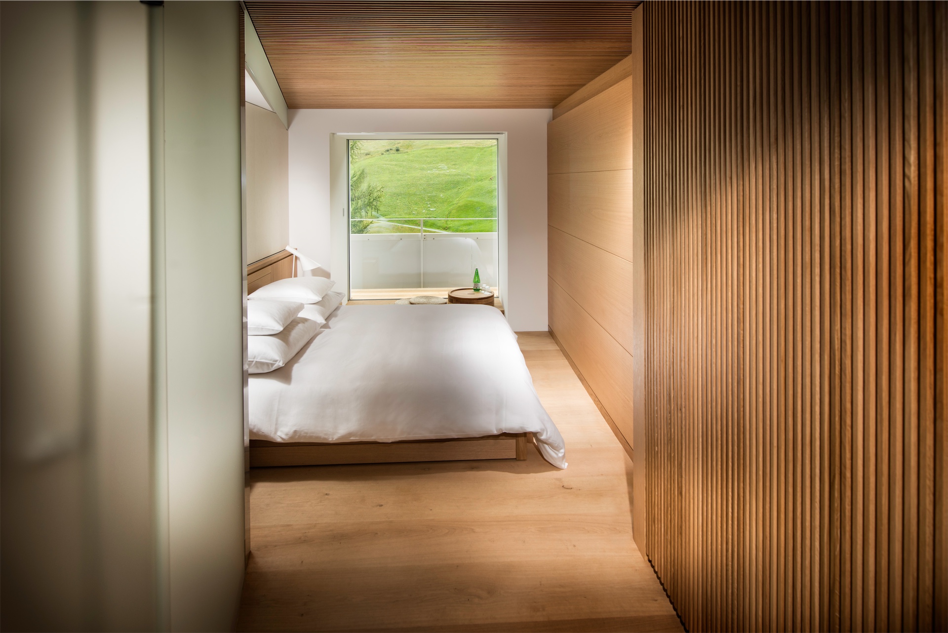 Minimalist bedroom in the Tadao Ando suite at 7132 House of Architects in Vals, Switzerland.