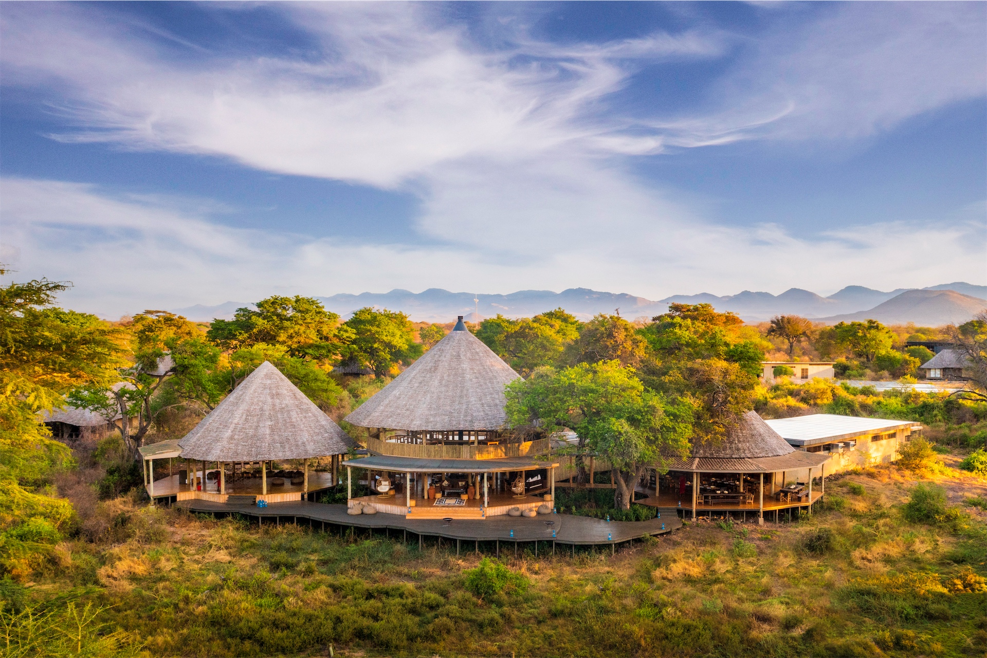 Chyulu Lodge main area set against the rolling Chyulu Hills.