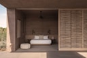 Open bedroom suite with woven sliding screen at Vipp Todos Santos.