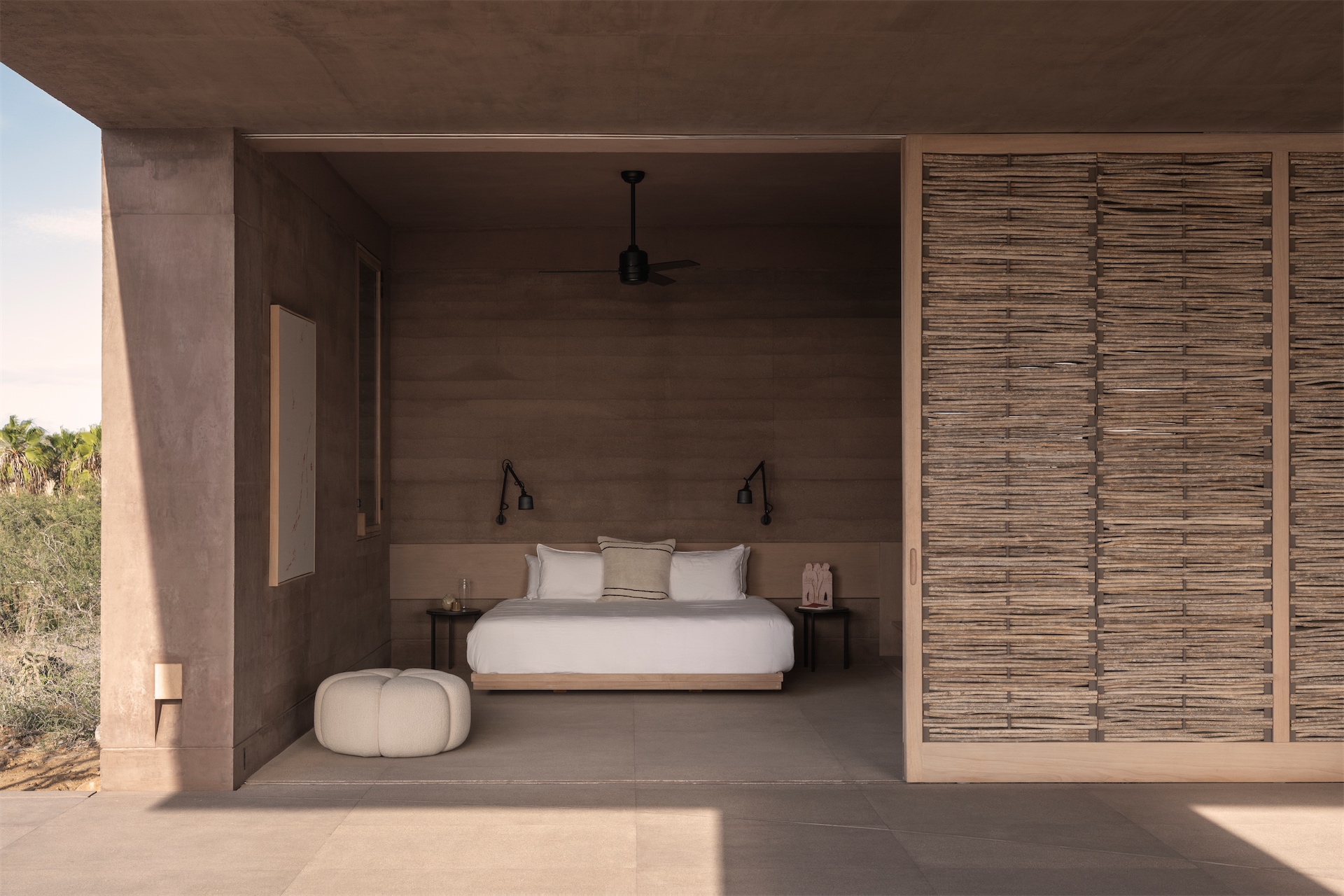 Open bedroom suite with woven sliding screen at Vipp Todos Santos.