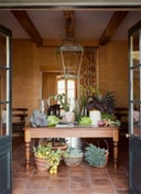Sterrekopje Farm Entrance Hall Harvest Table With Seasonal Produce And Lantern