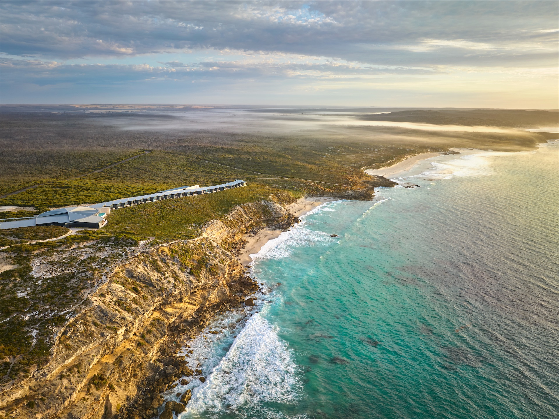 southern-ocean-lodge-aerial-clifftop-sunrise
